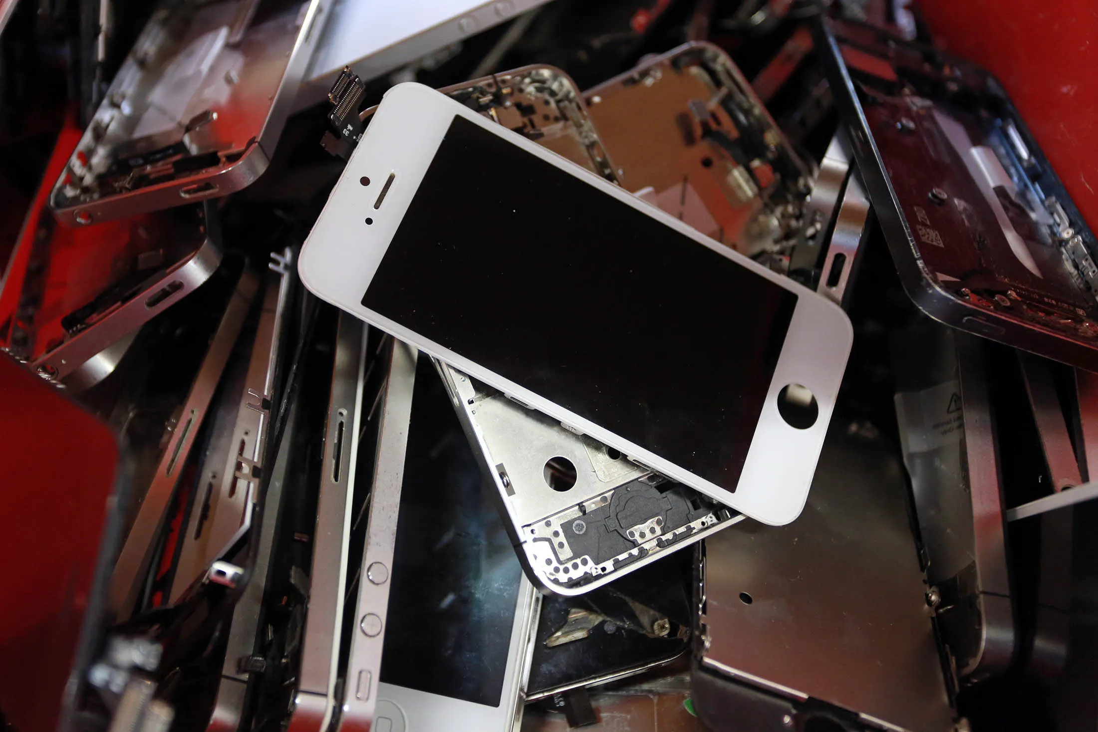 At the end of their useful lives, many iPhones face the crusher.
