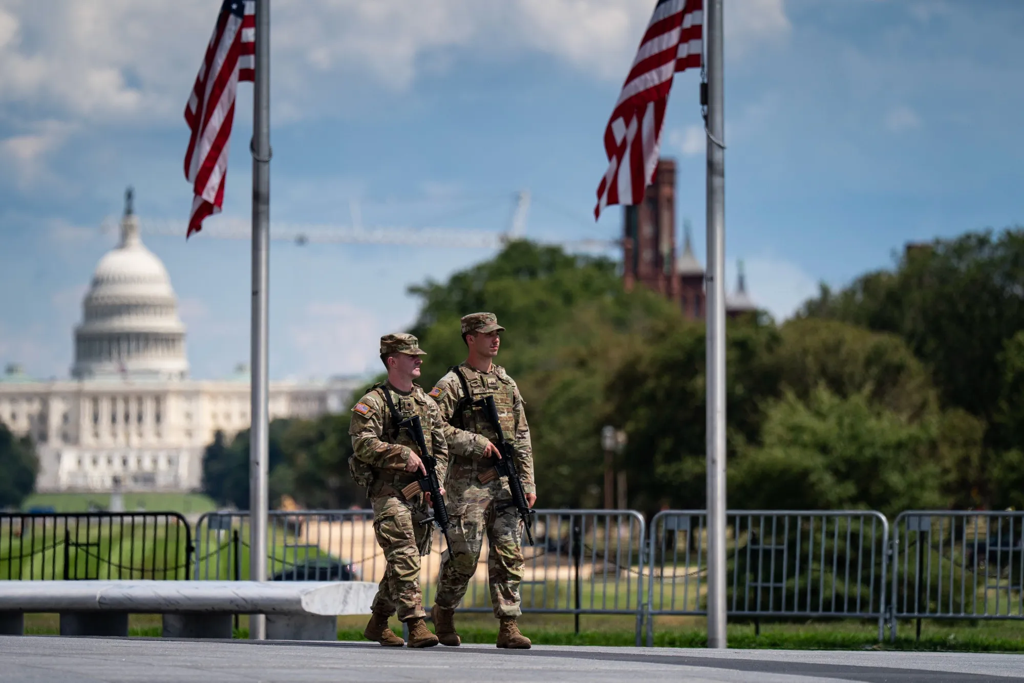 Members of the West Virginia National Guard patrol near the Washington Monument on the National Mall in Washington.&nbsp;The District of Columbia is suing over Trump’s deployment of National Guard troops in the nation’s capital.