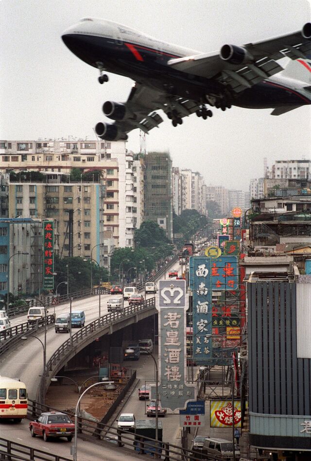 A jetliner makes its approach in 1990 to Kai Tak airport, which closed in 1998.