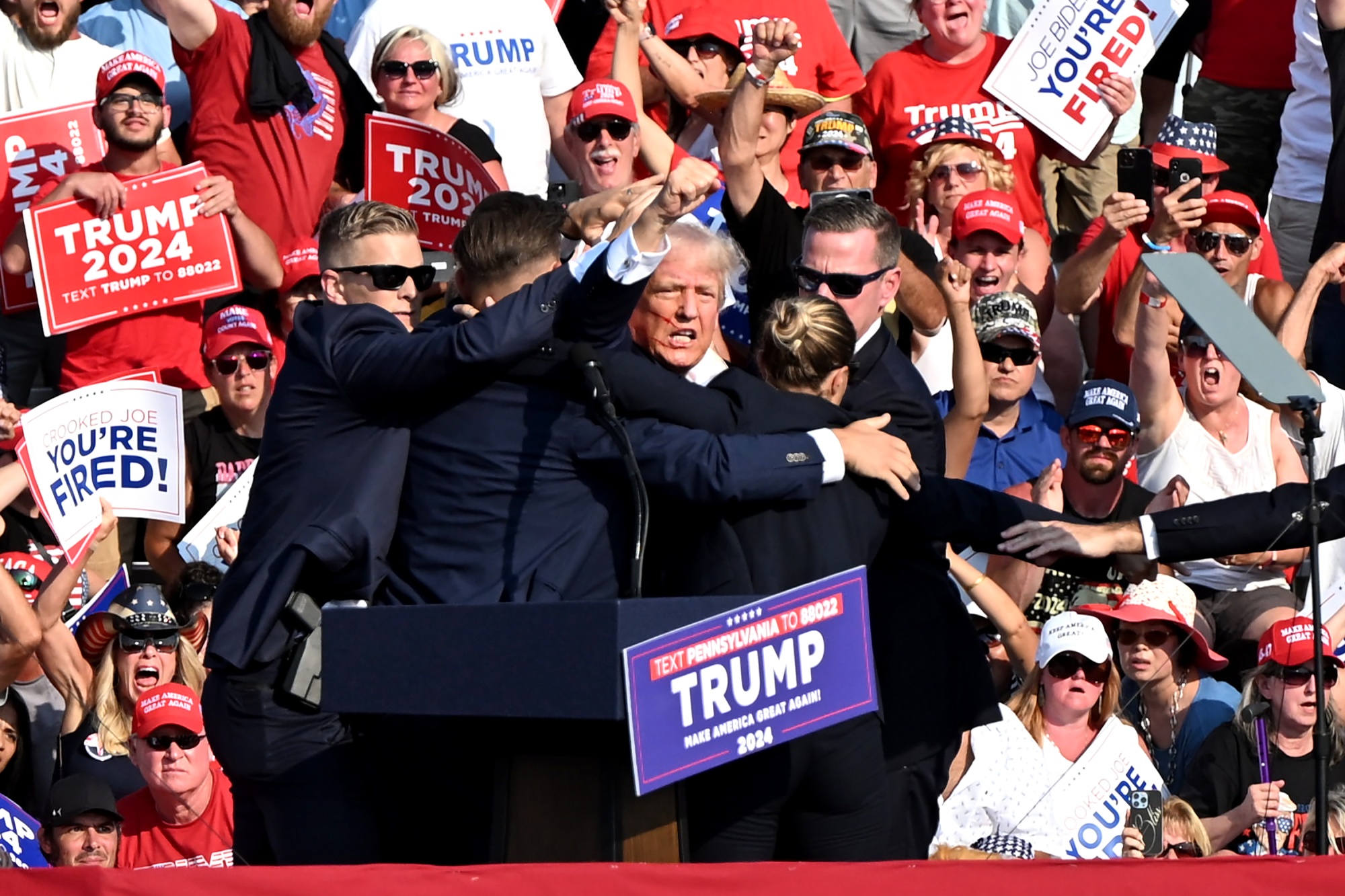 Donald Trump is surrounded by Secret Service agents during a campaign event at Butler Farm Show Inc. in Butler, Pennsylvania, US, on July 13.