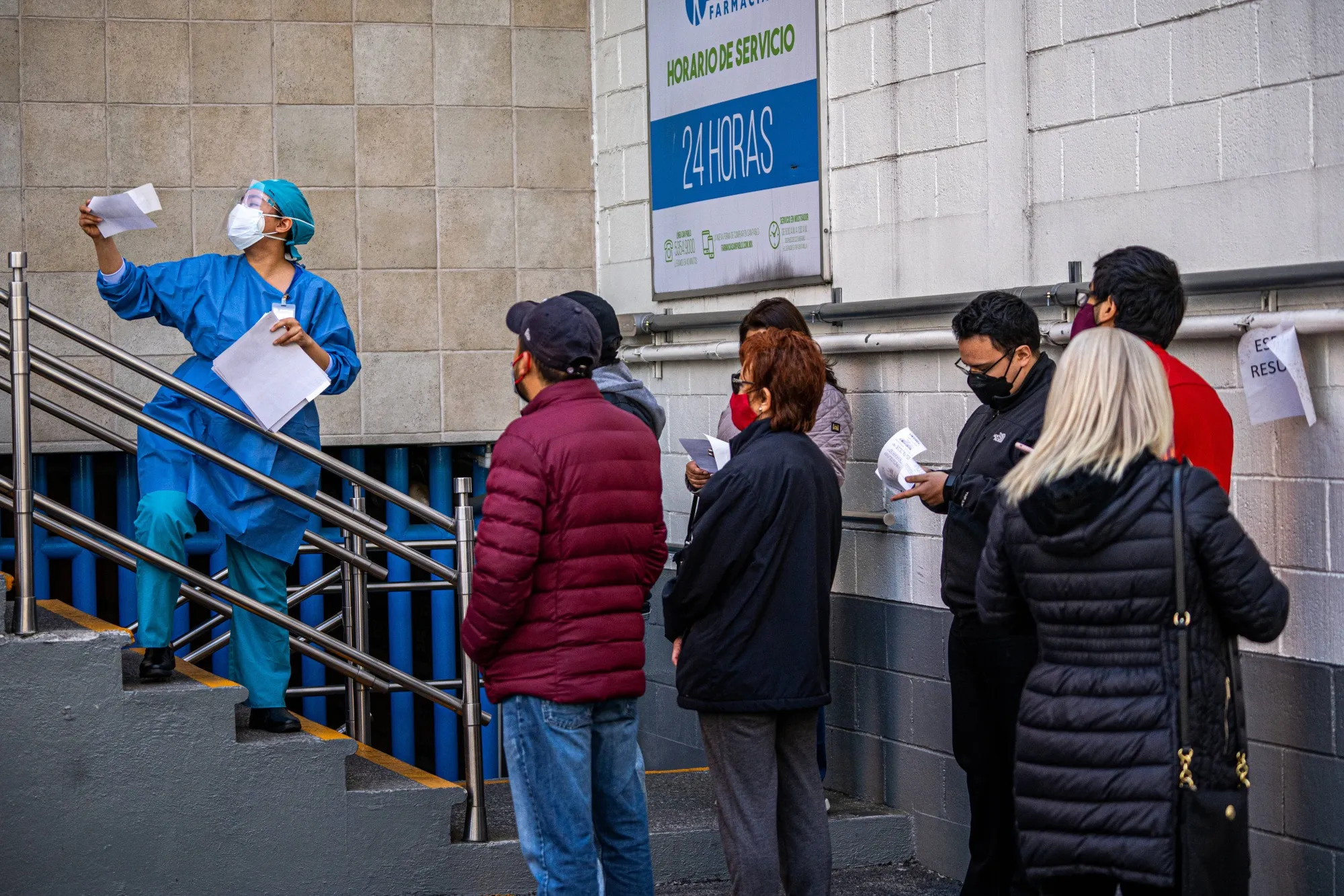 A healthcare worker delivers Covid-19 test results in Mexico City on&nbsp;Jan 6.&nbsp;