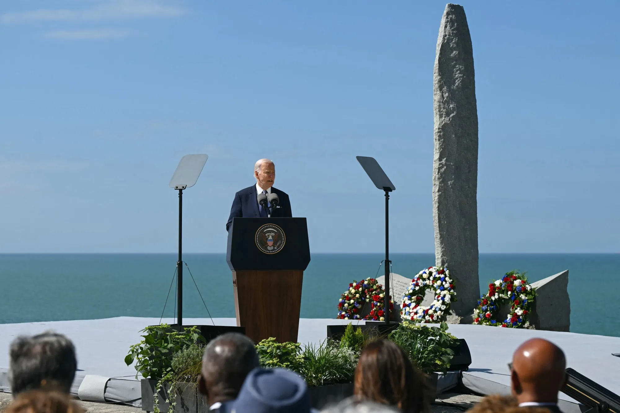 Joe Biden delivers a speech in front of the monument on the "Pointe du Hoc" clifftop in Cricqueville-en-Bessin, France&nbsp;on June 7.