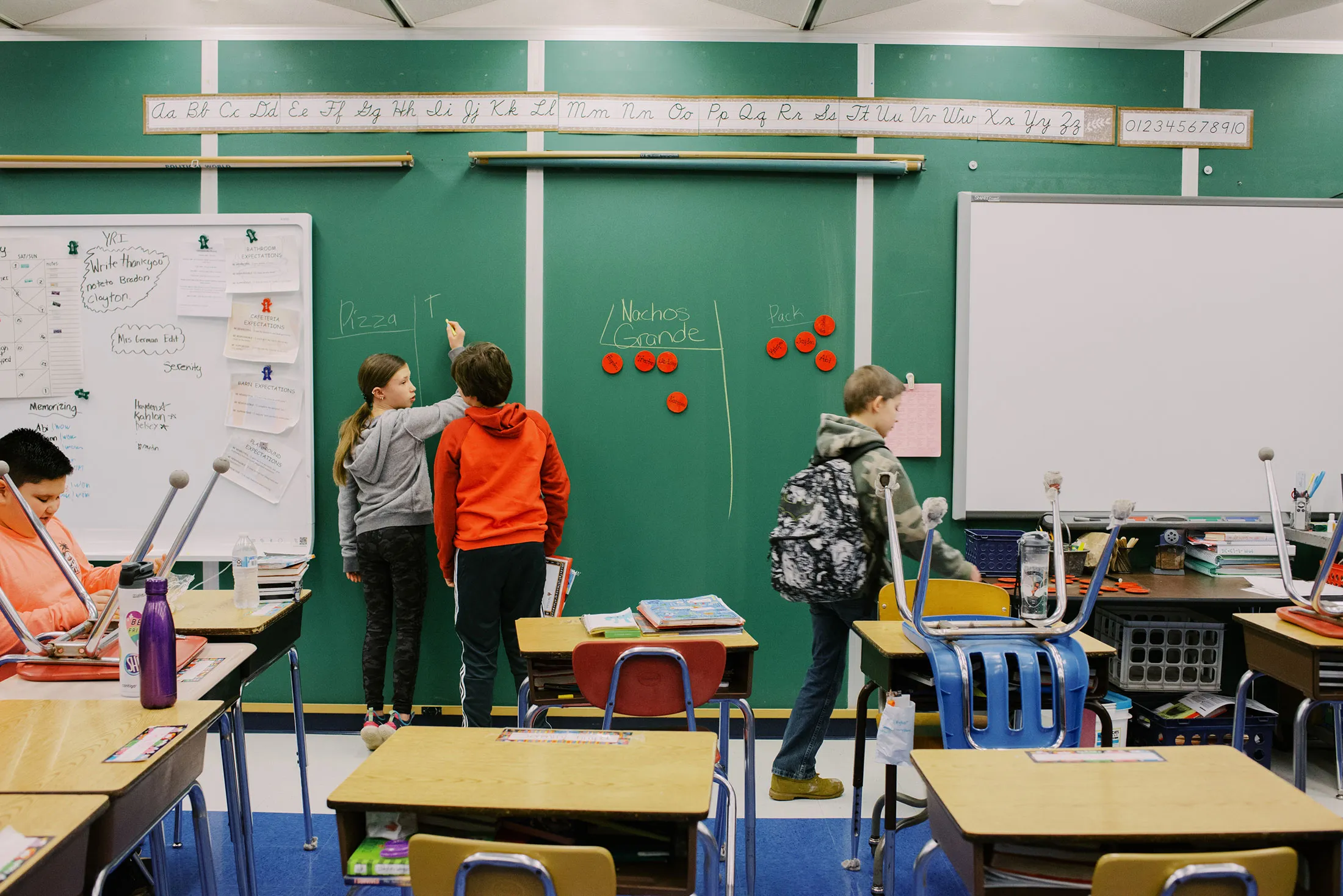 Fifth graders at Crellin Elementary School get settled into their classroom in the morning.&nbsp;