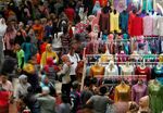 Shoppers crowd a Jakarta market during Ramadan.