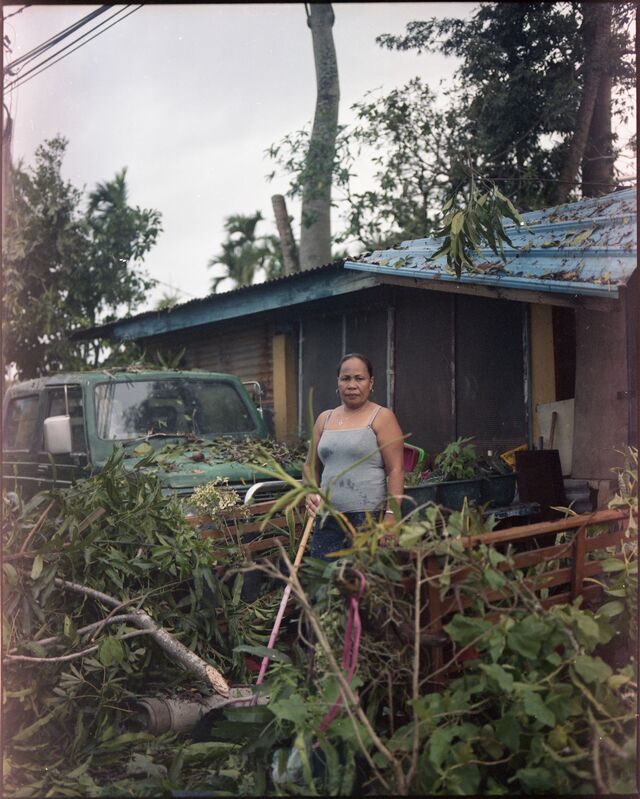 Anniesia Maderzo, a Filipina who has lived in Palau for nearly 15 years, dealing with storm damage at her home