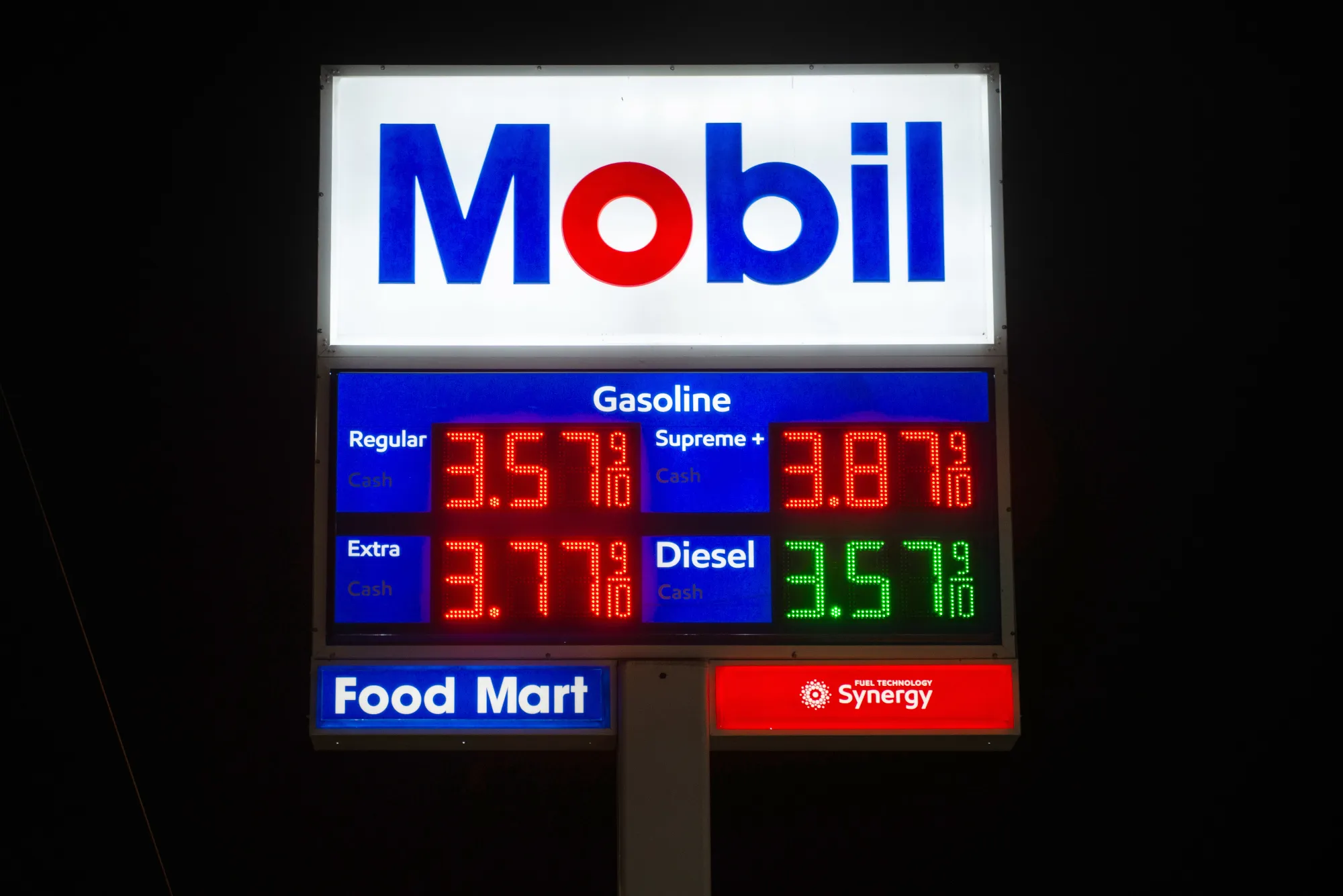 Signage displays fuel prices at an Exxon Mobil Corp. gas station.