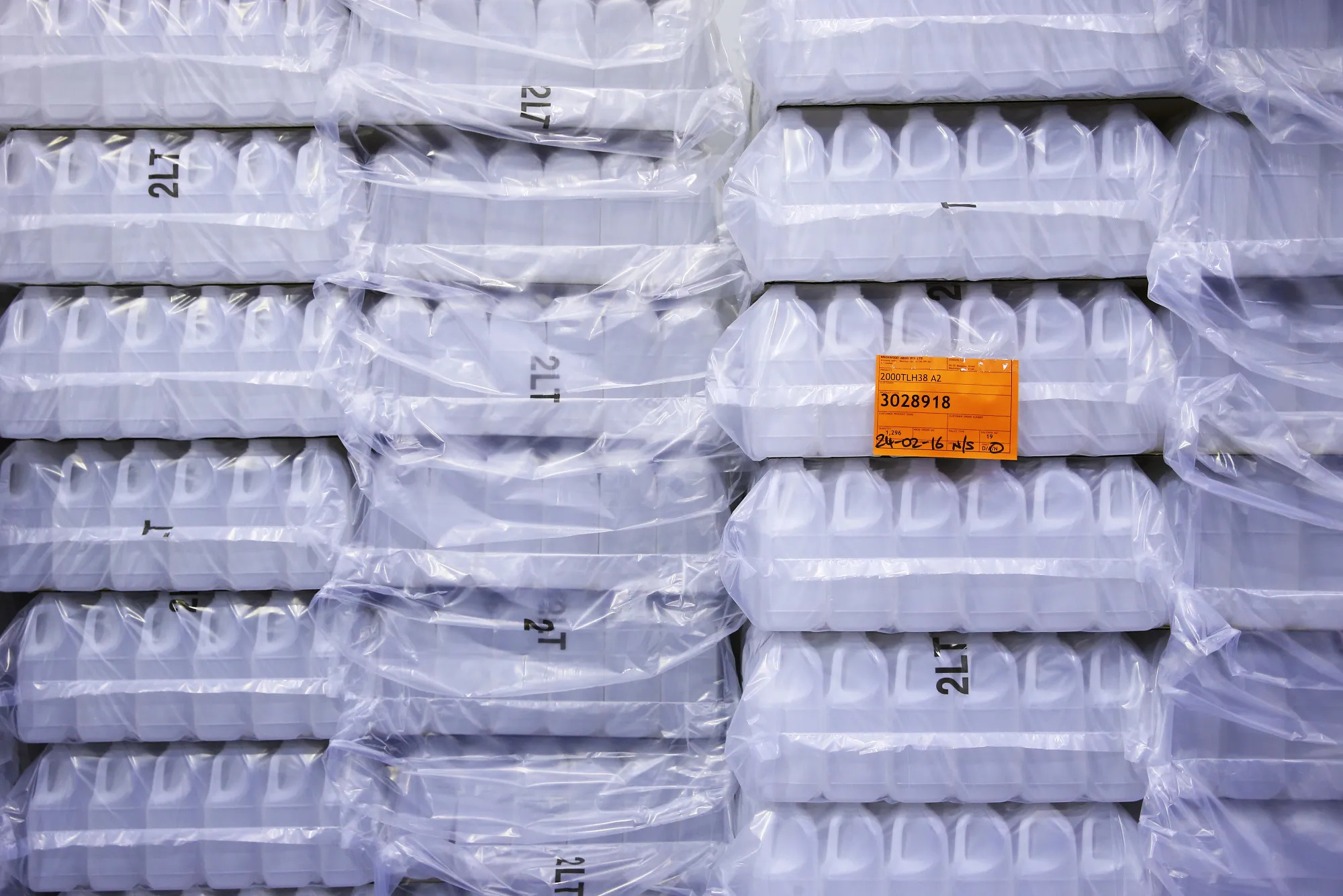Empty plastic bottles are stacked at the a2 Milk Co. plant in Sydney, Australia, on Friday, Feb. 26, 2016. Founded in 2000 by New Zealand scientist Corran McLachlan and multimillionaire farm owner Howard Paterson, a2 Milk's market value has more than tripled to NZ$1.2 billion over the past year.