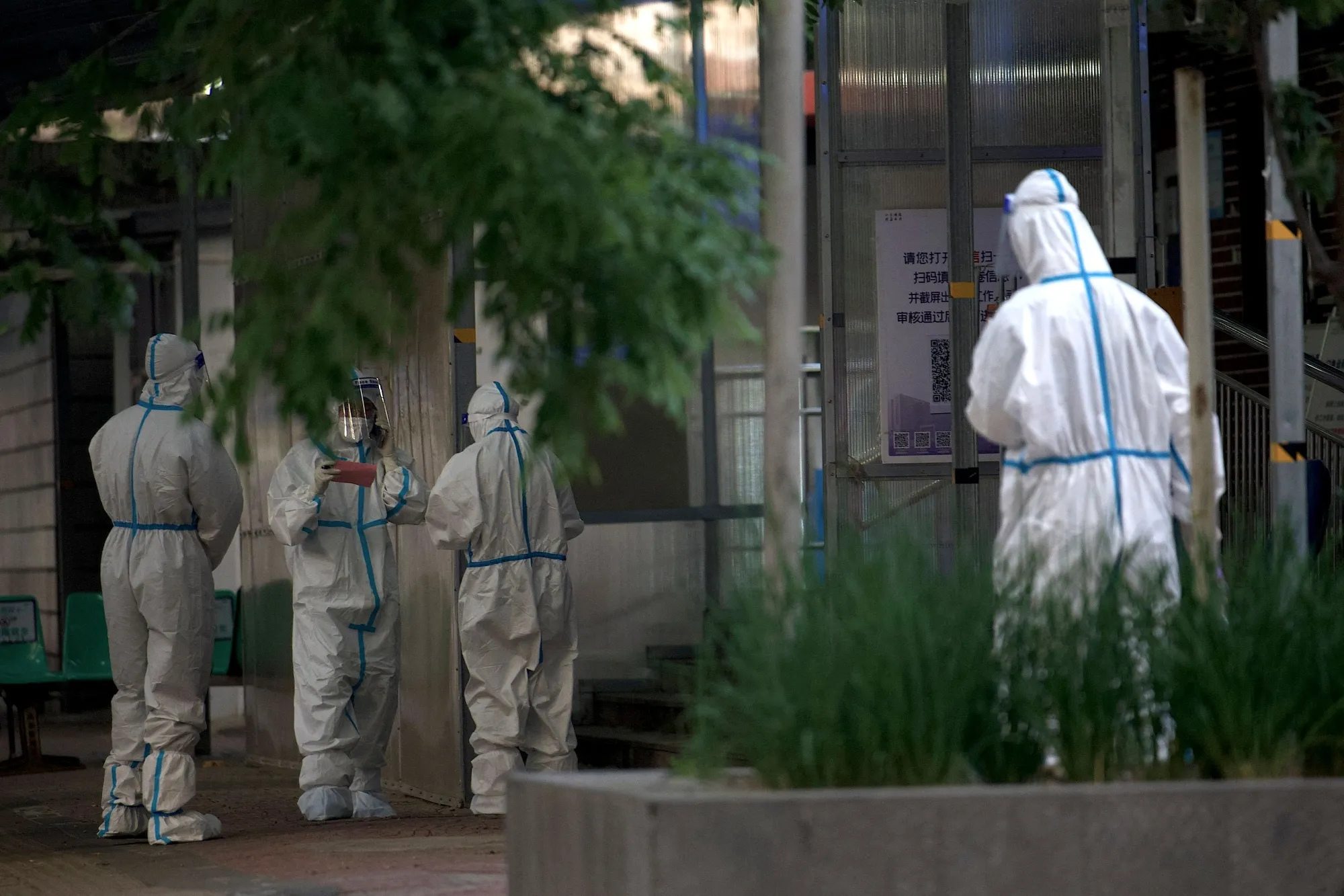 Health workers at a hospital across a residential area under lockdown due to Covid-19 in Beijing on May 22.