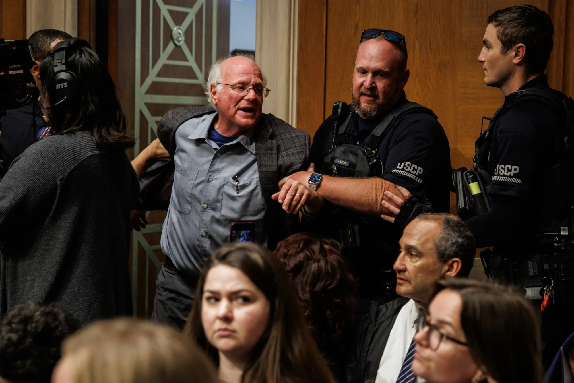 Ben Cohen is detained by U.S. Capitol Police for disrupting proceedings on Capitol Hill on May 14.