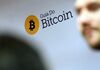 The Bitcoin cryptocurrency symbol sits displayed on a wall during the Crypto Investor Show in London, U.K., on Saturday, March 10, 2018. The meeting is the largest crypto and blockchain event for investors in the U.K.