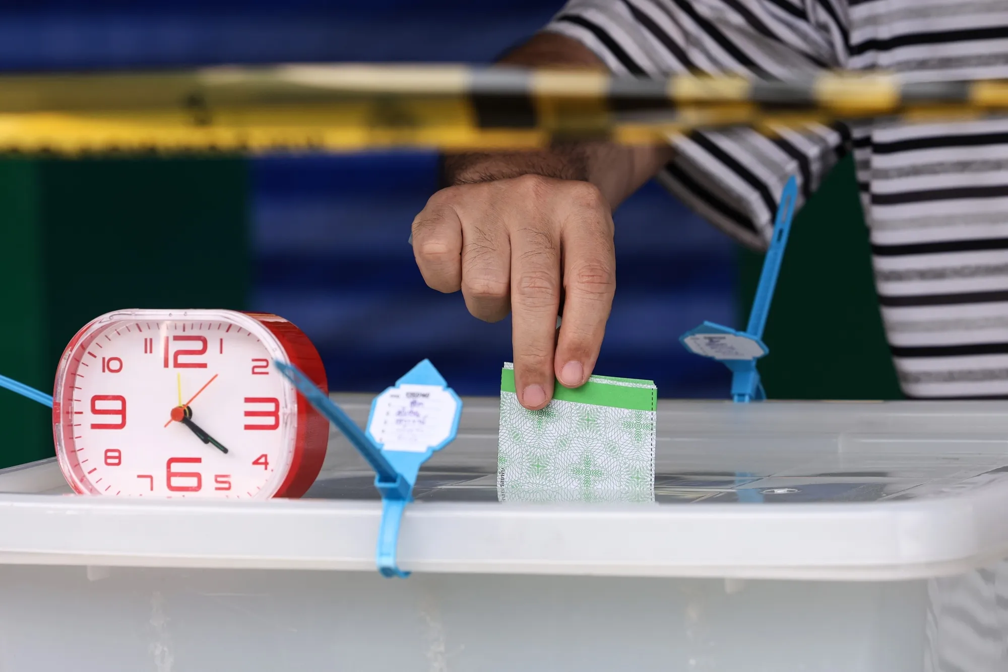 A voter casts a ballot during Thailand's general election in Bangkok, on Feb. 8.