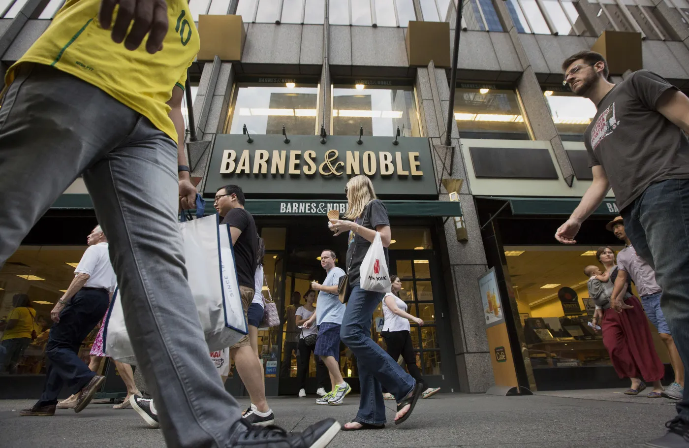 Pedestrians walk past a Barnes &amp; Noble Inc. store in New York in 2015.
