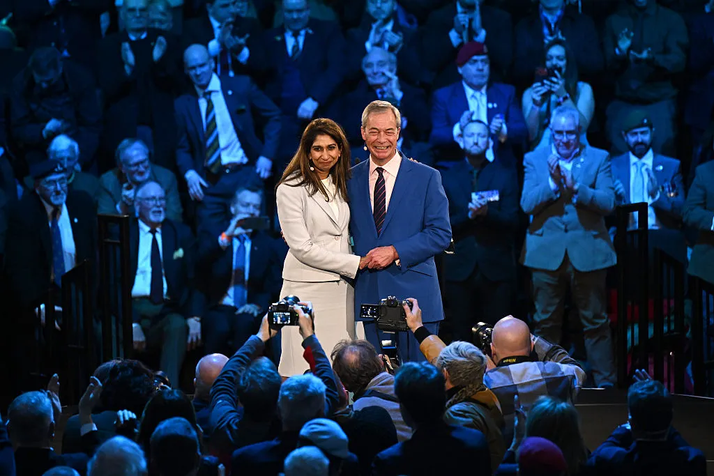 Shades of blue: Nigel Farage embraces former Conservative Home Secretary Suella Braverman.&nbsp;