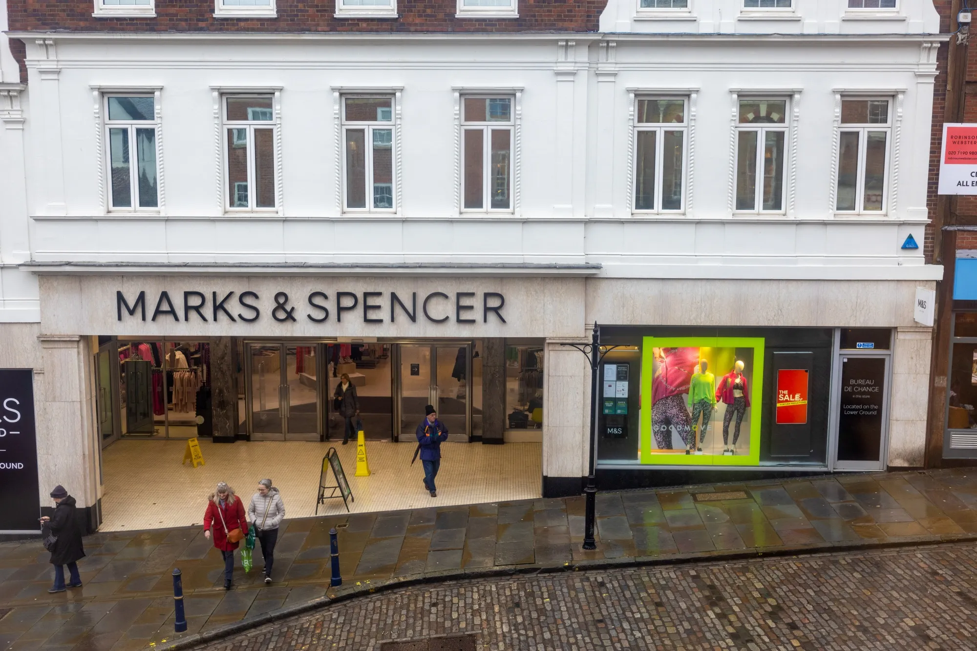 Shopper outside a Marks & Spencer store.