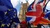 Pro-Brexit and anti-Brexit protesters hold flags as they demonstrate outside the Houses of Parliament in London on March 14, 2019 as members debate a motion on whether to seek a delay to Britain's exit from the EU. - MPs vote on March 14 on whether to seek a Brexit delay, as the chaotic process to end Britain's 46-year membership of the EU plunges the country into deep political crisis. (Photo by Tolga AKMEN / AFP) (Photo credit should read TOLGA AKMEN/AFP/Getty Images)