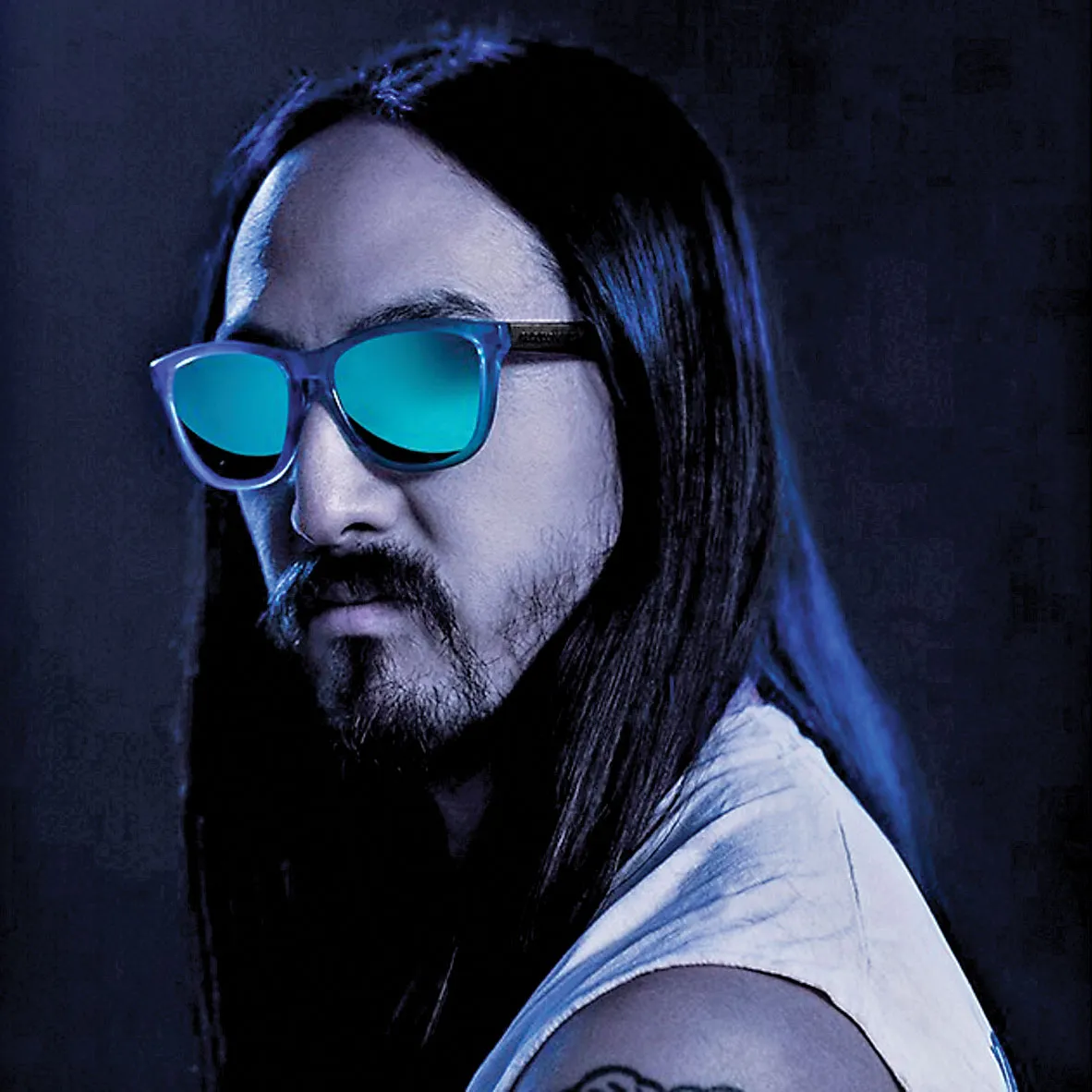 Electronic musician Steve Aoki wears Hawkers shades in a promo.
