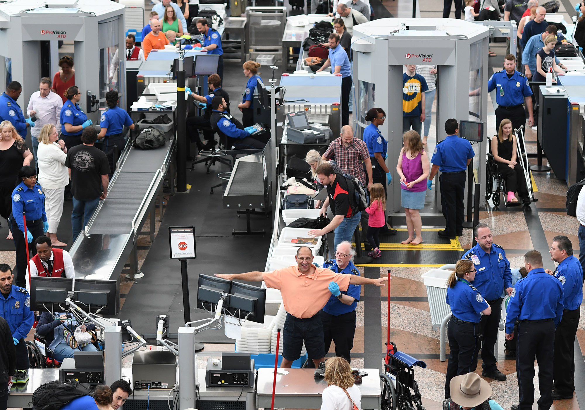 Travelers, at Denver International Airport, make their way through security lines on May 26, 2016.
