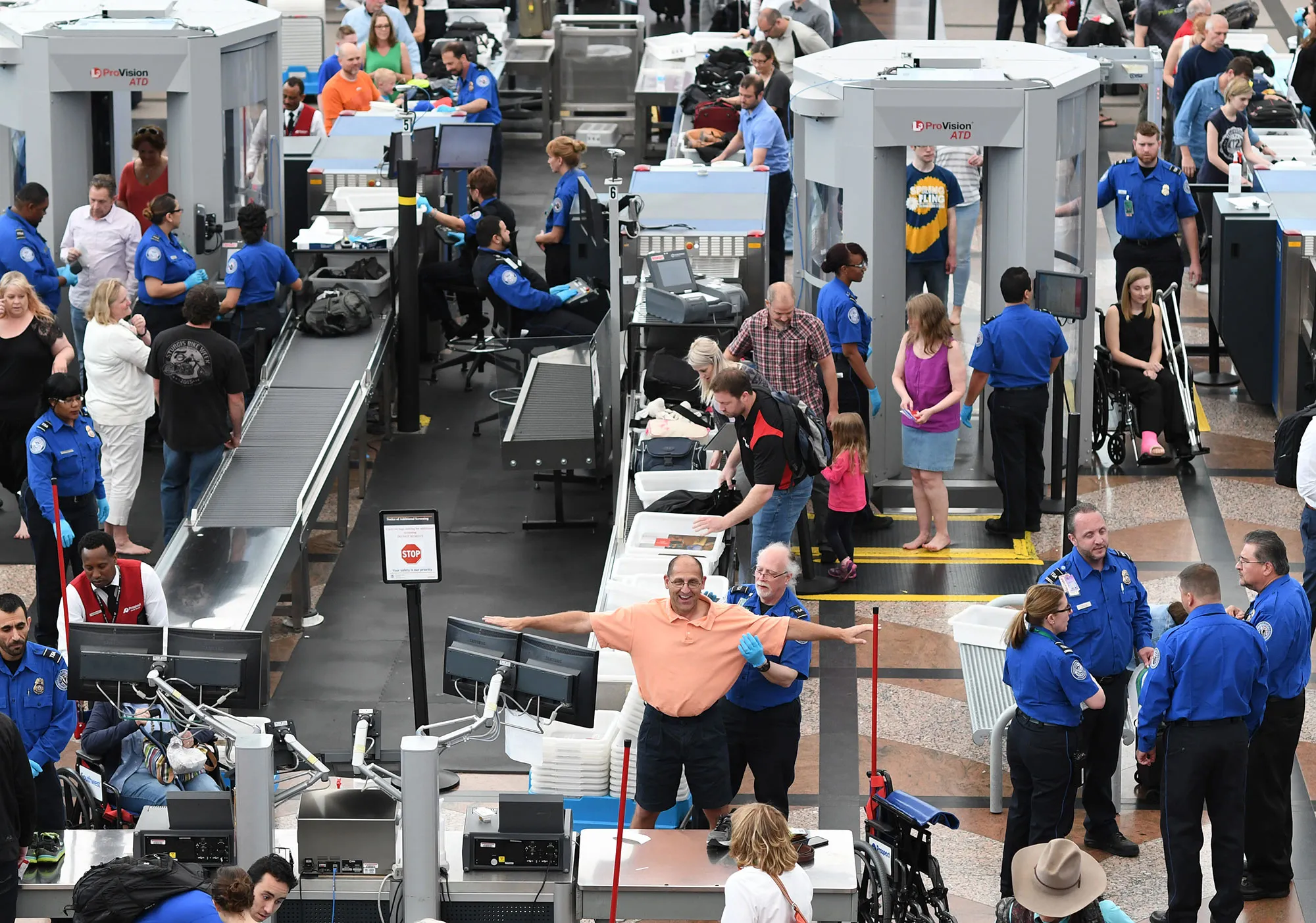 Travelers, at Denver International Airport, make their way through security lines on May 26, 2016.

