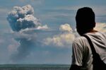 A man watches Krakatau spewing ash during an eruption, in Serang, Indonesia's Banten province on April 11.