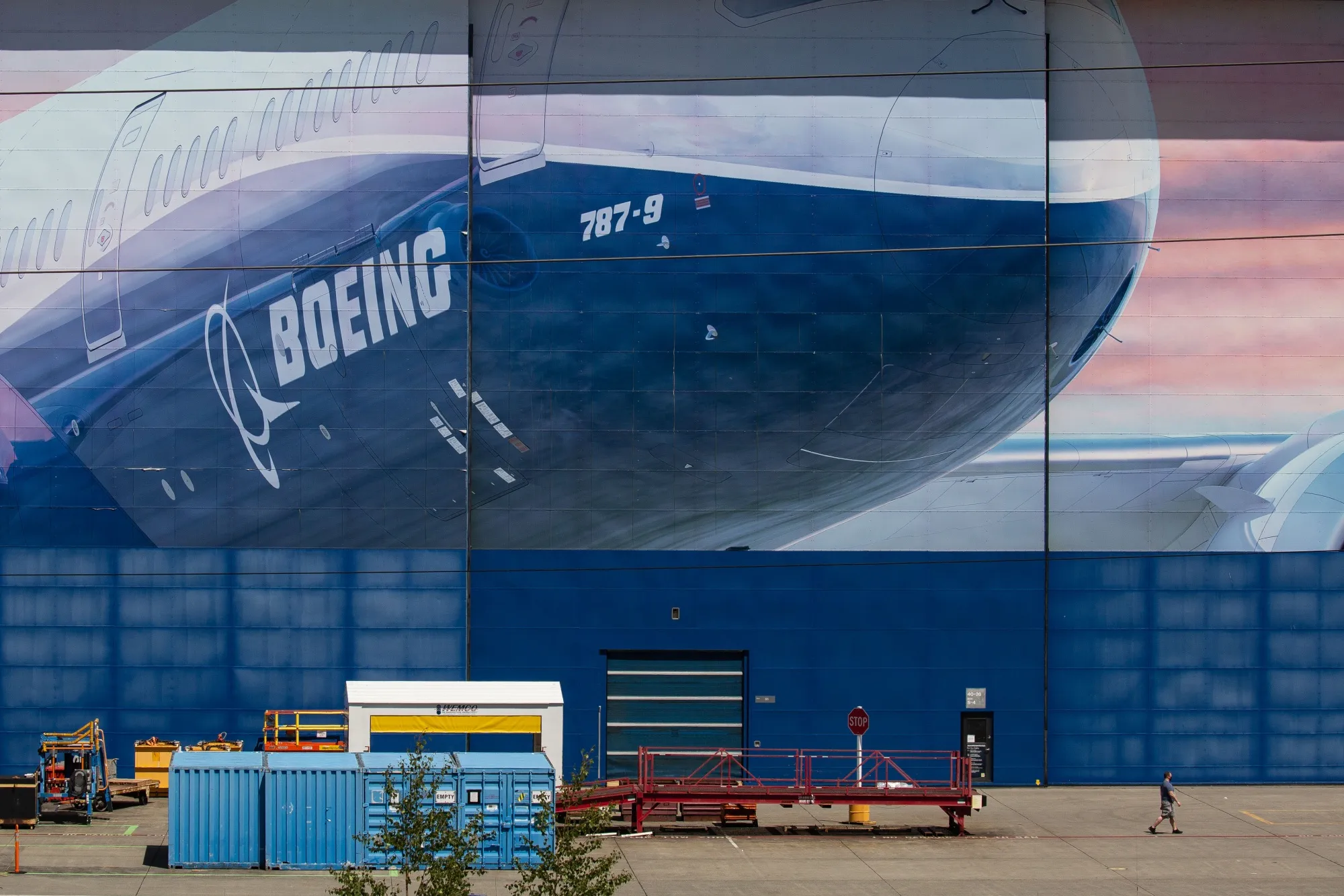 A worker walks outside of a Boeing facility in Everett, Washington.