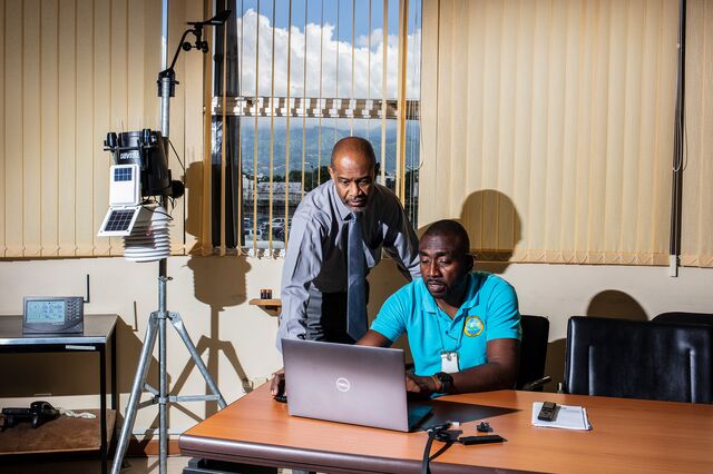 Principal Director Evan Thompson (left) and Senior Meteorological Technician Lerone Lynch (right) review data from a Davis Vantage Pro 2 weather station at the Meteorological Service of Jamaica offices in Kingston, Jamaica on September 11, 2024. 