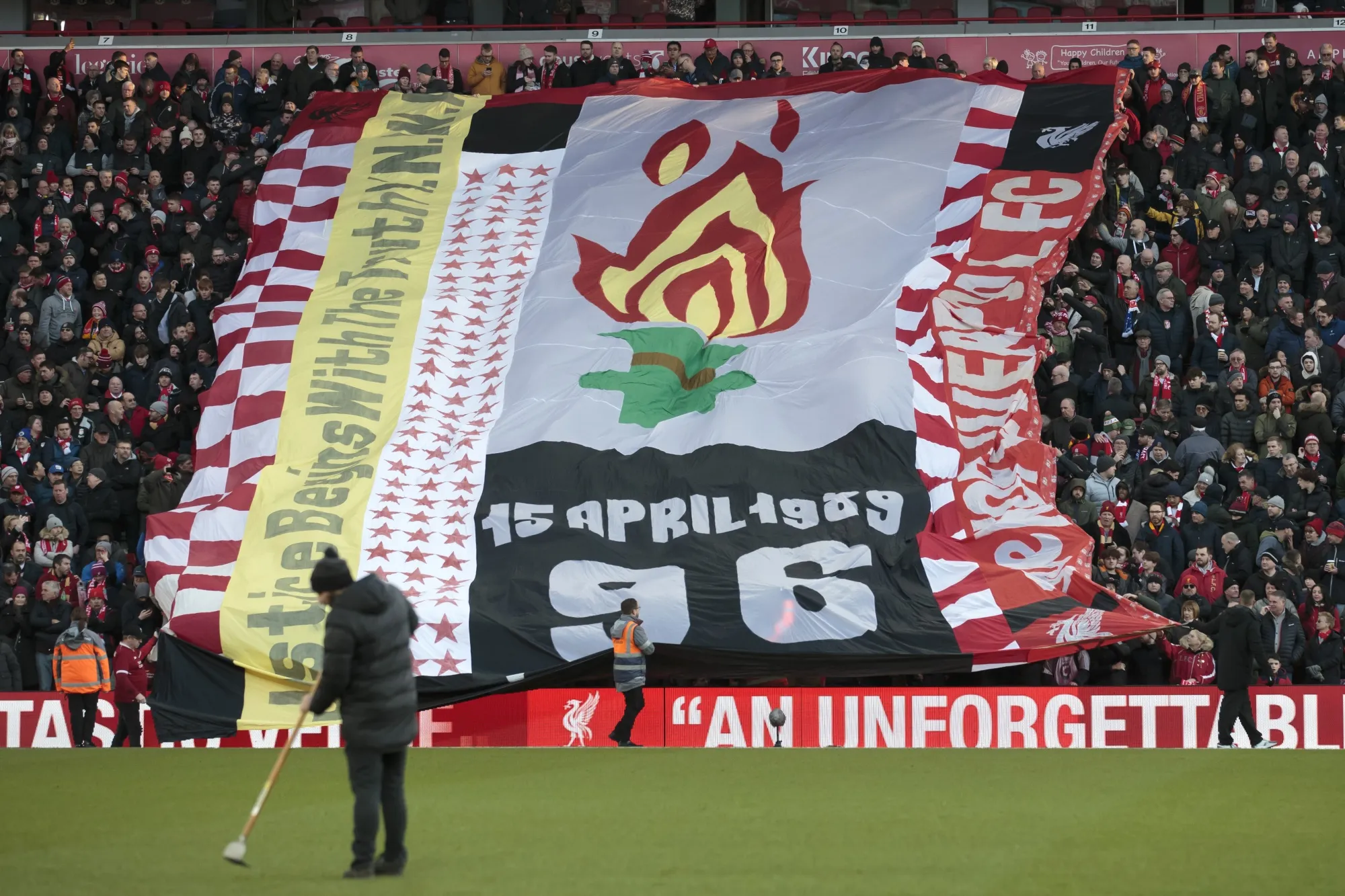 Fans hold up a tribute to the victims of the Hillsborough disaster before the English Premier League soccer match between Liverpool and Brighton at Anfield Stadium, Liverpool, England, Saturday, Nov. 30, 2019. The British government apologized Wednesday, Dec. 6, 2023 to the families of 97 Liverpool soccer fans who died after a stadium crush 34 years ago, as it introduced a charter it said will sharply diminish the chances that others will endure the kinds of injustices they suffered. (AP Photo/Jon Super, file)