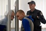 Russian sergeant Vadim Shishimarin listens to a court sentence in Kyiv, on May 23.