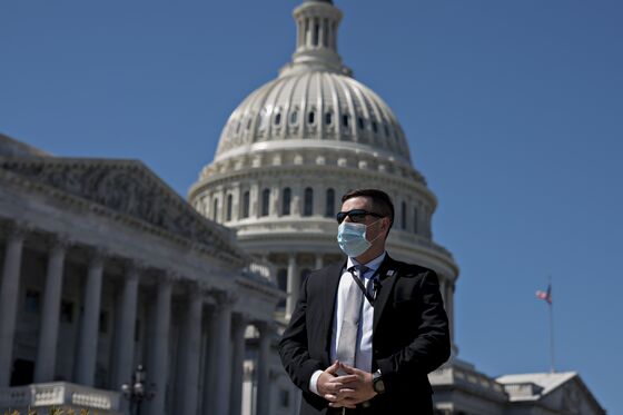 Masked Lawmakers to Vote in Person to Pass $484 Billion Stimulus