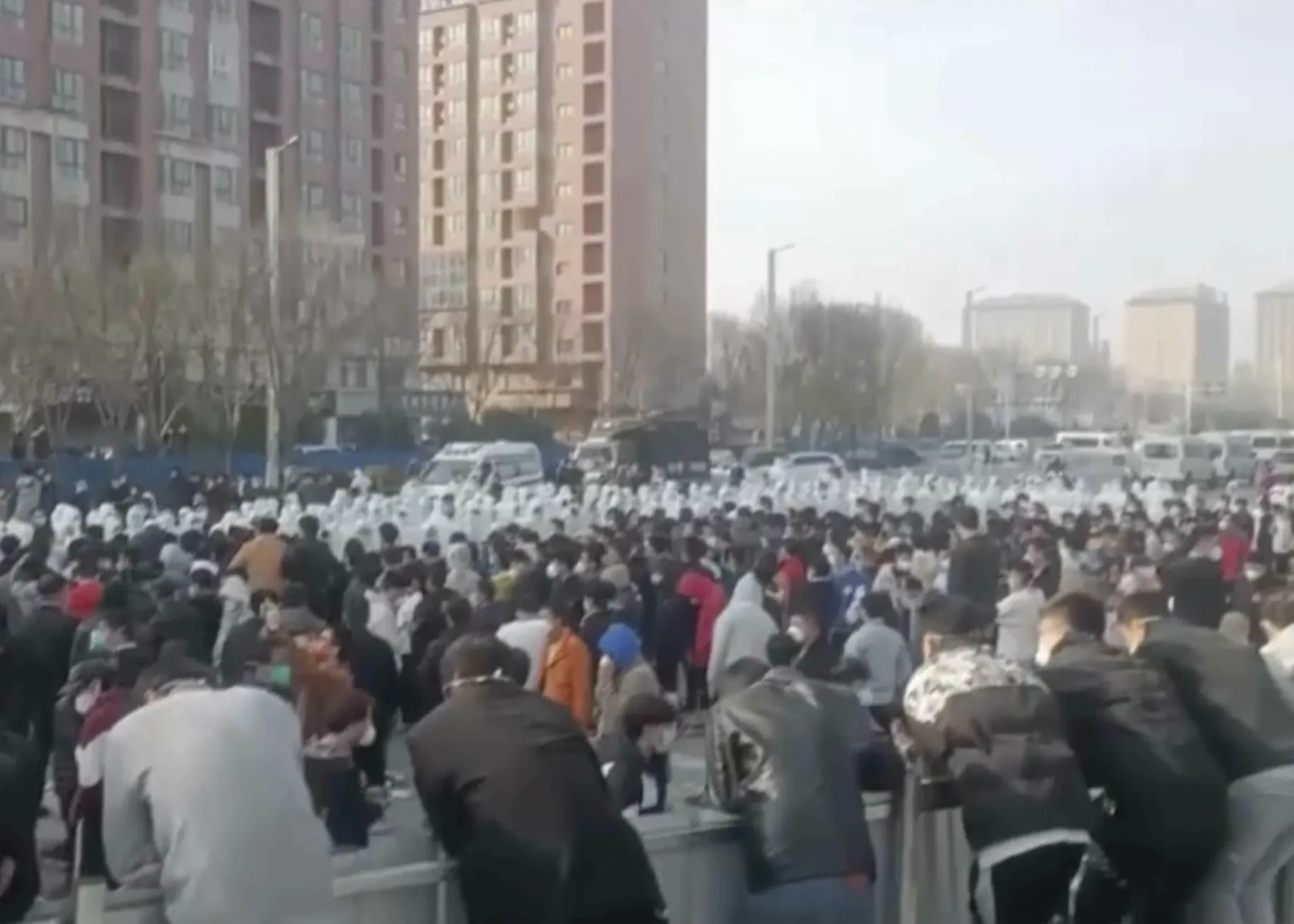 Protesters face off against security personnel.