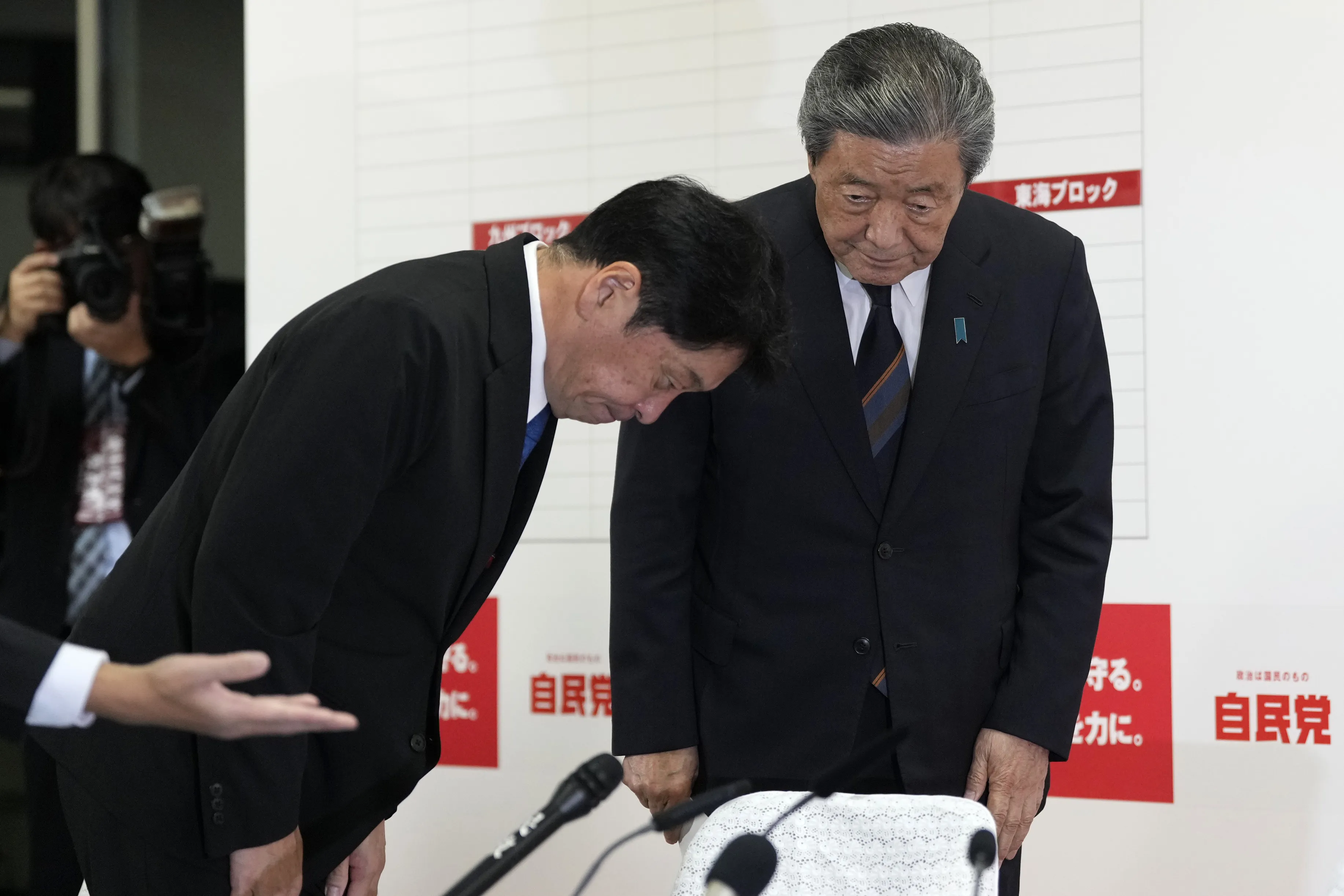 Hiroshi Moriyama, secretary general of the Liberal Democratic Party (LDP), right, and Itsunori Onodera, chairperson of policy research council of the Liberal Democratic Party (LDP), bow following the lower house election, at the party's headquarters in Tokyo, Japan.