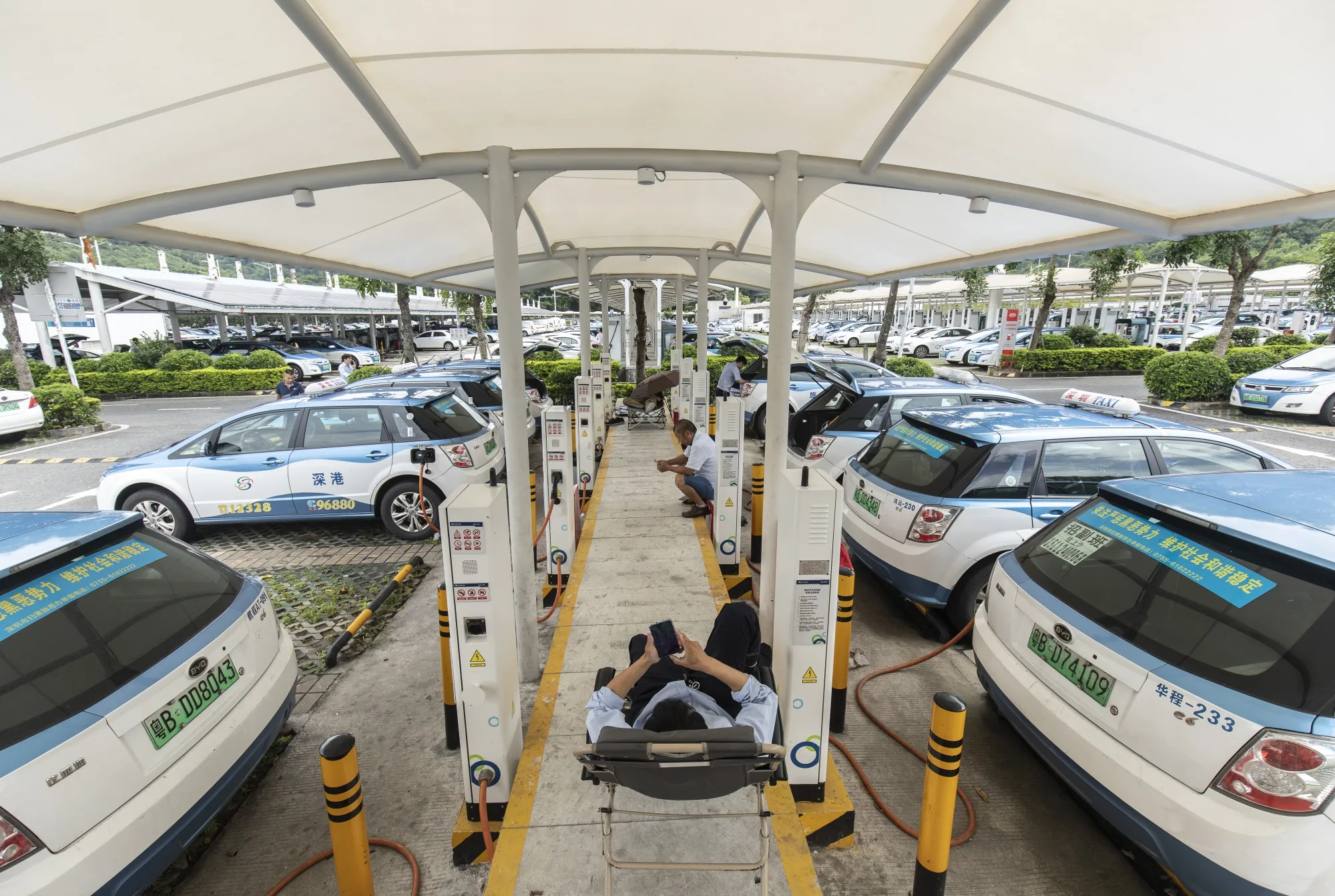 BYD Co. electric vehicles charge at a charging station in Shenzhen, China.&nbsp;