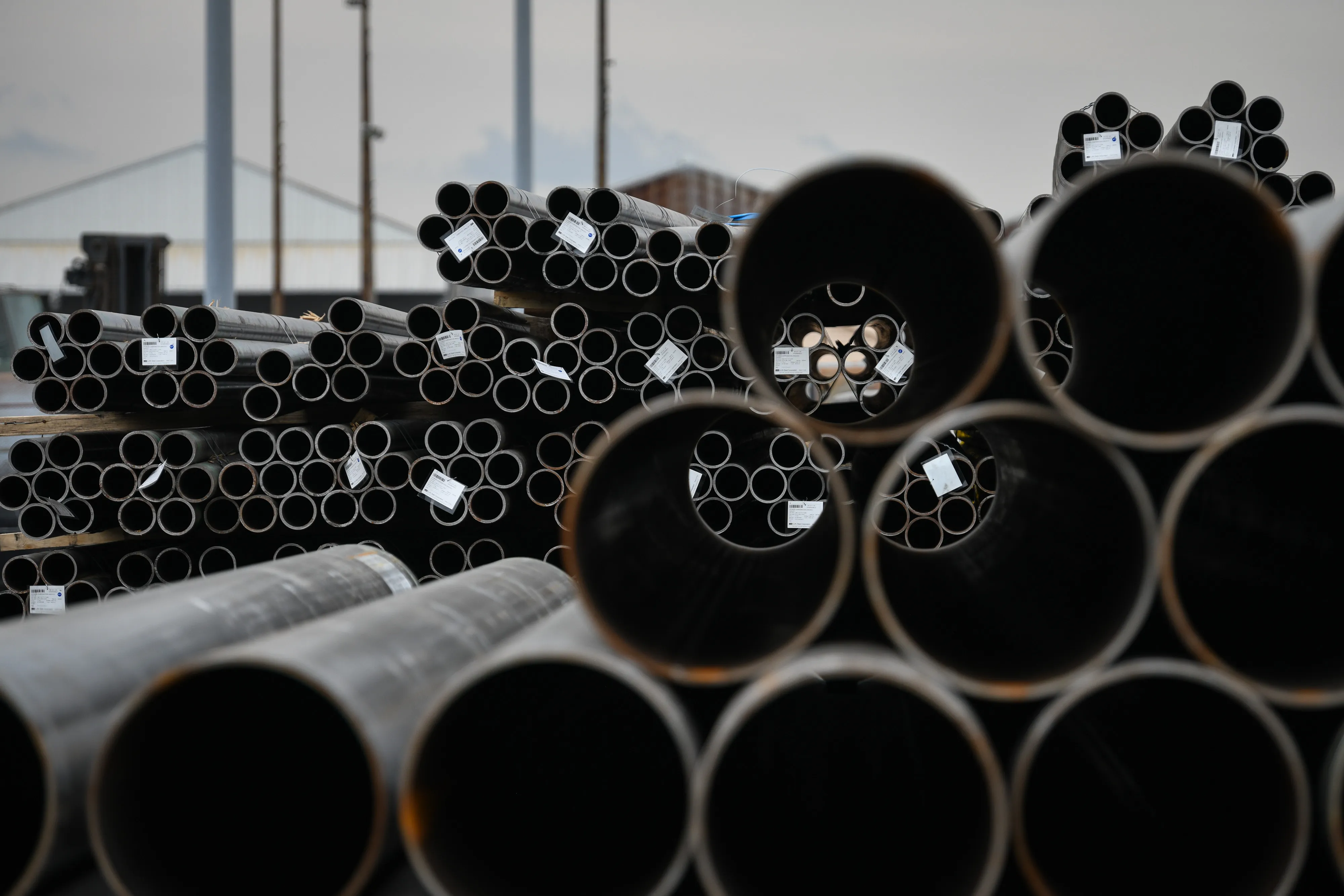 Steel pipes sit stacked at the Port of Houston in Texas.