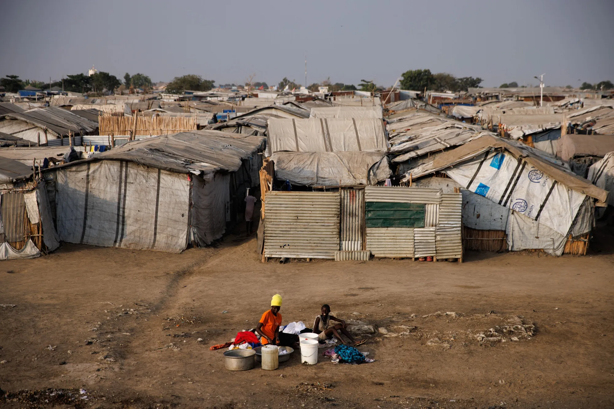Women wash clothes in an Internally Displaced Persons camp&nbsp;in Bentiu, South Sudan.