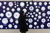 A visitor looks at a screen full of QR codes at the WeChat World conference held in Guangzhou, China on Monday, 15 January 2018