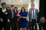House Speaker Nancy Pelosi, center, is seen on Capitol Hill in Washington, on Feb. 7.