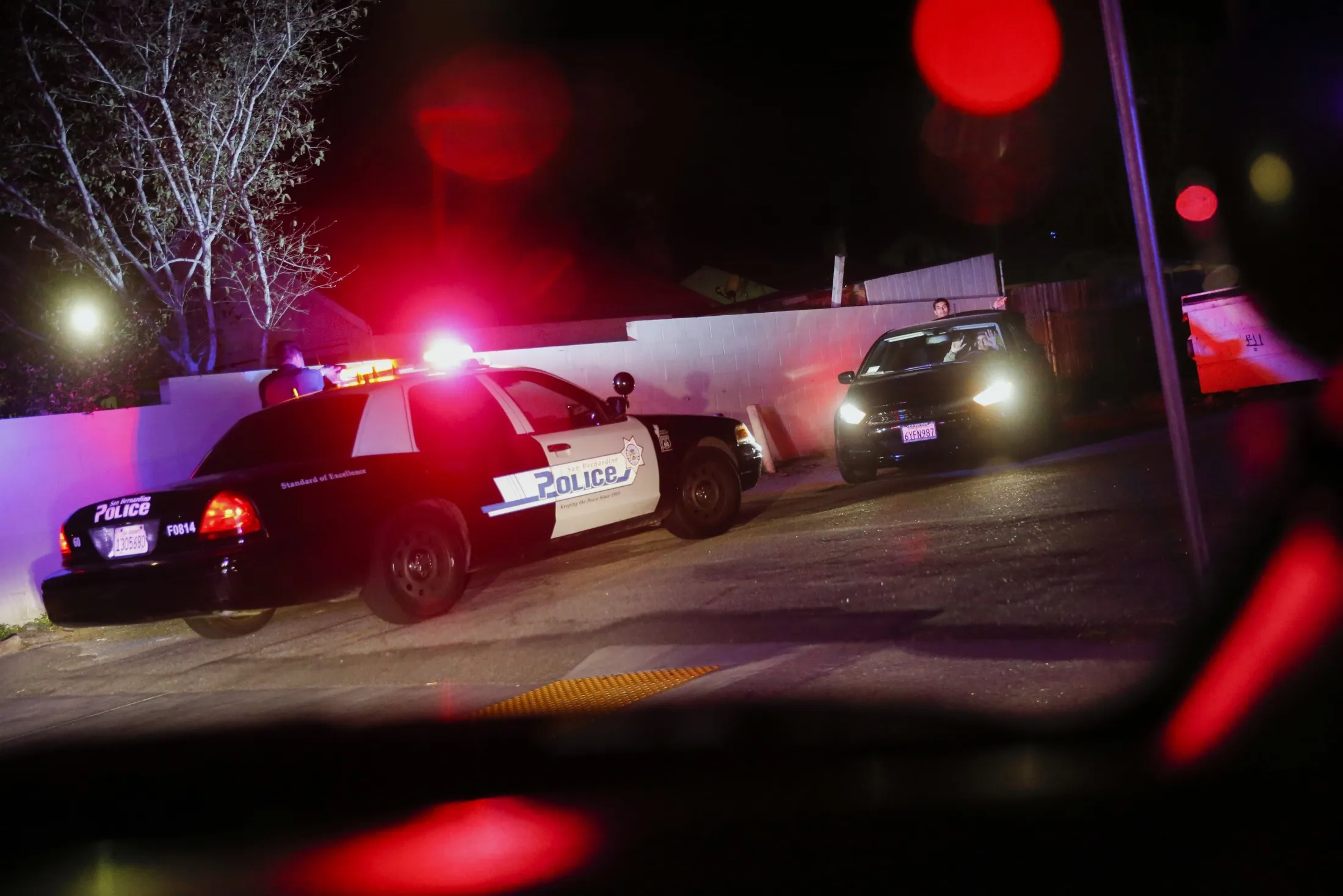 A San Bernardino Police Department officer&nbsp;during a traffic stop. The department is among dozens&nbsp;to have used ODIN Intelligence’s platform, which was hacked this month.