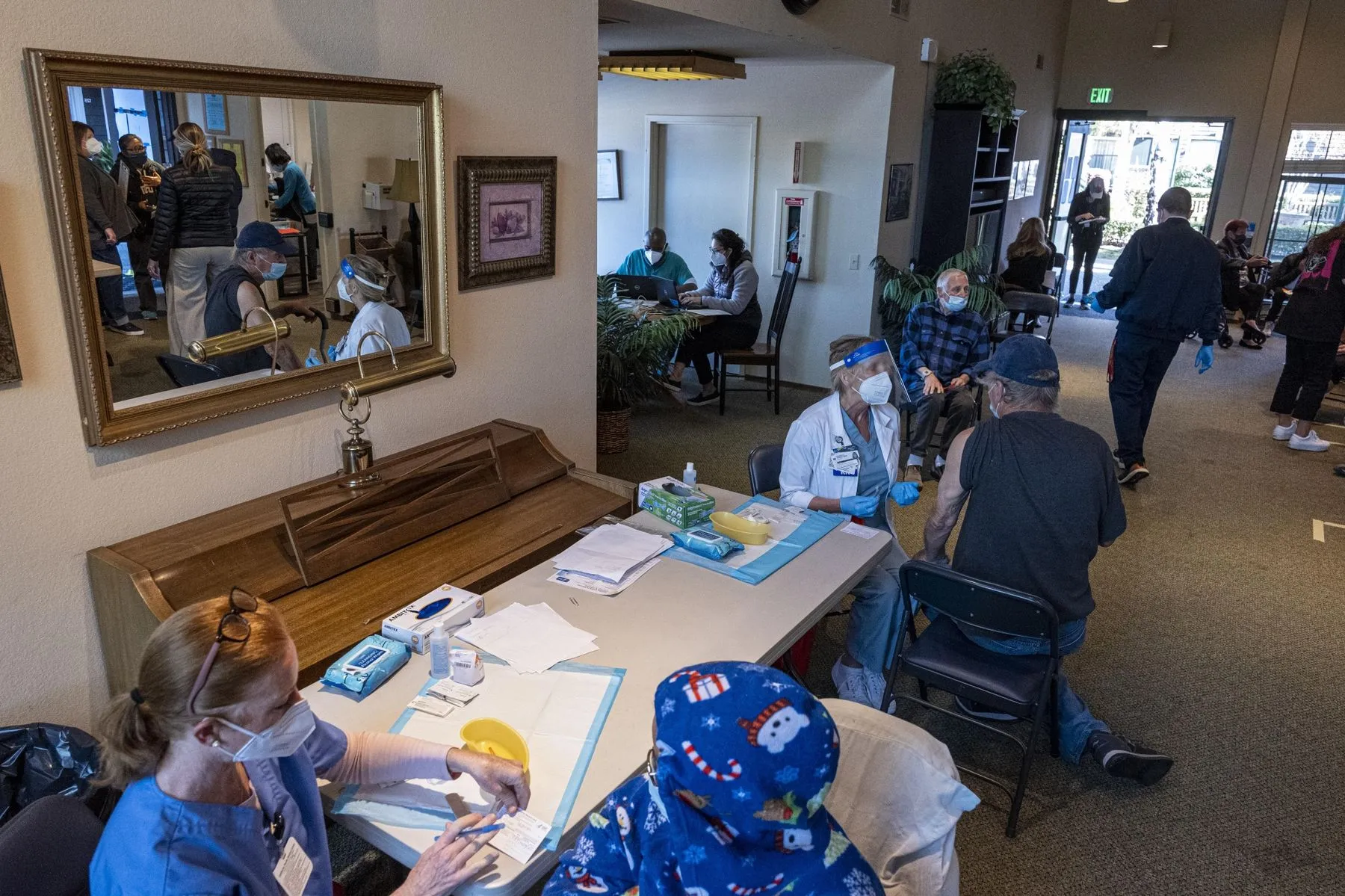 
One of Marin County’s mobile vaccine teams gets needles&nbsp;into arms&nbsp;at San Rafael Commons.
