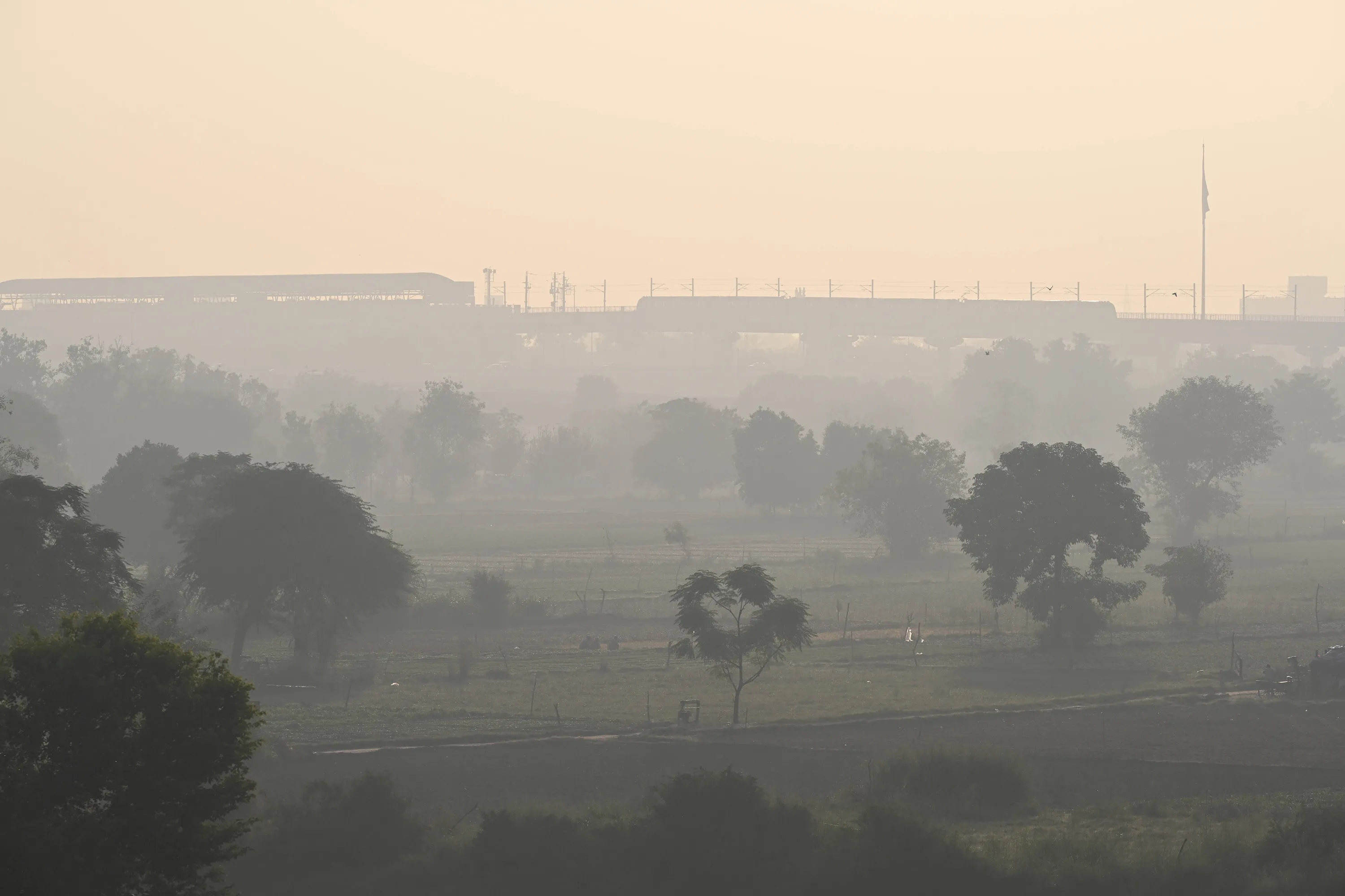 Delhi Metro trains in smog near Yamuna Bank in New Delhi, India, on Oct. 19.&nbsp;