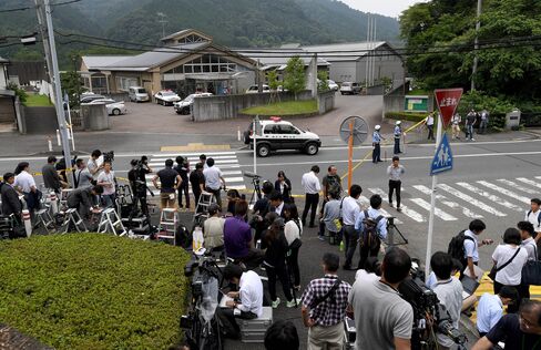 Journalists gather in front of the Tsukui Yamayuri En care center in Sagamihara, Kanagawa prefecture on July 26.