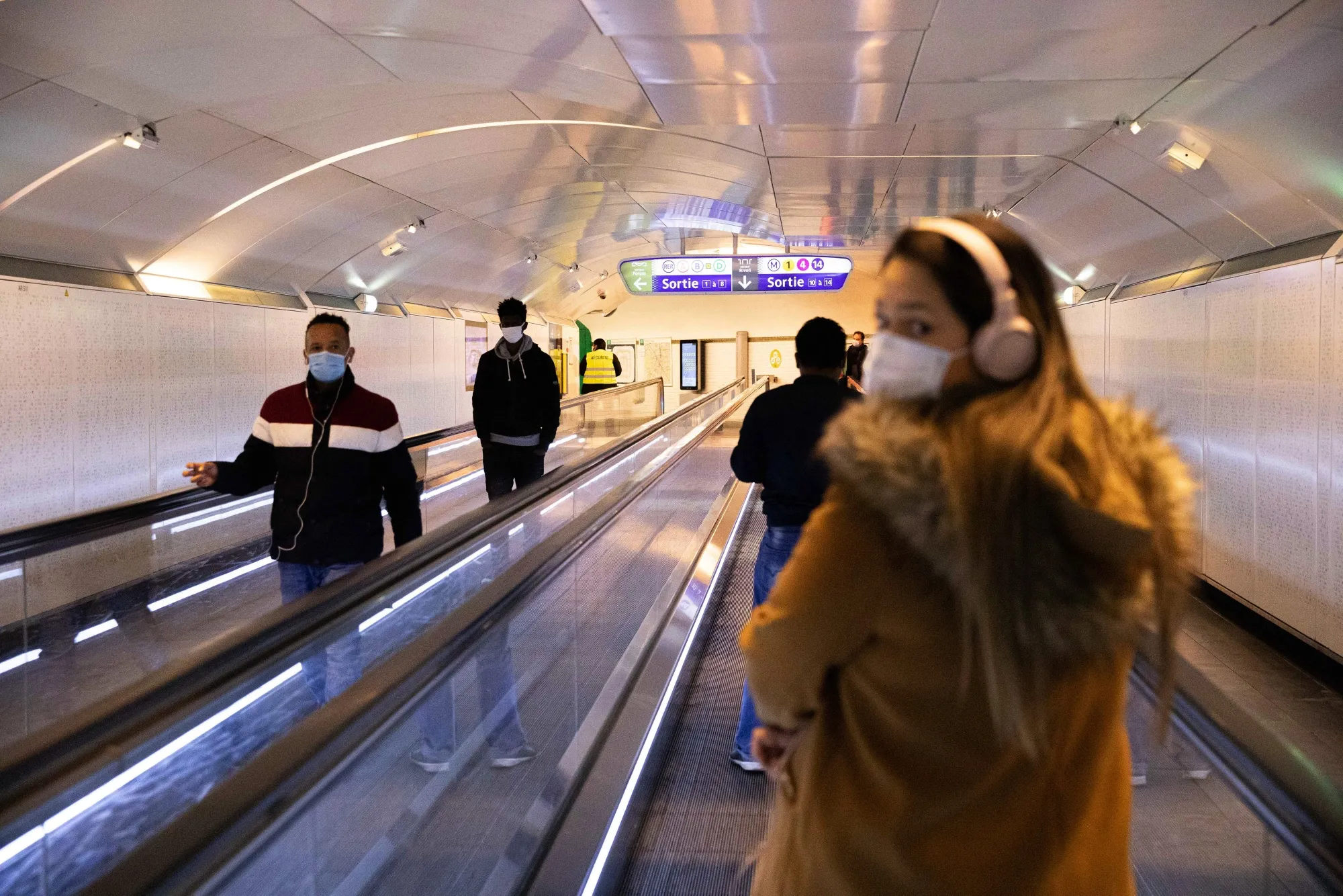 Travelers pass through Chatelet-Les-Halles metro station in Paris, on May 12.