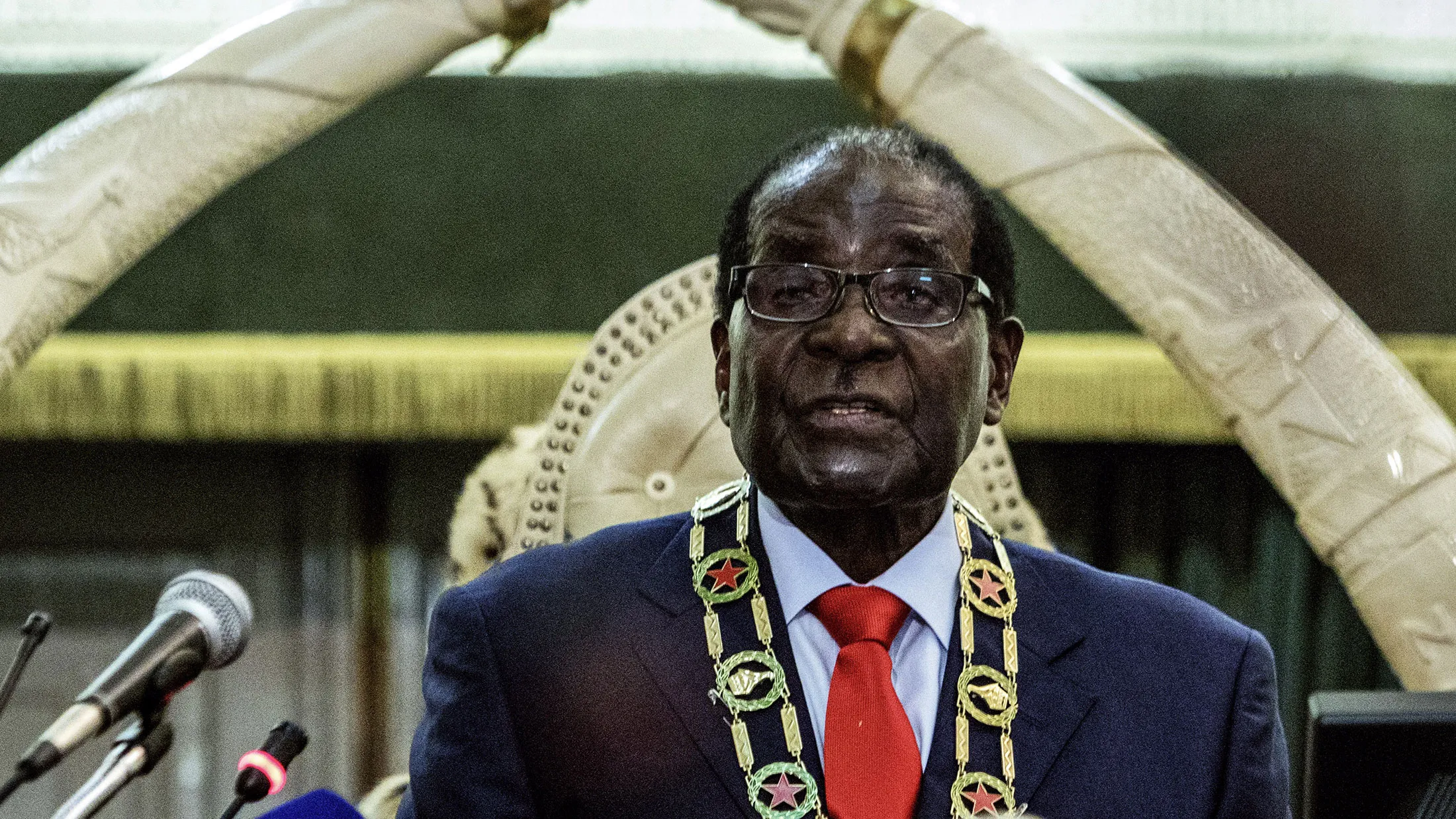 Zimbabwe's President Robert Mugabe delivers his State of the Nation address in Parliament in Harare on August 25, 2015.
