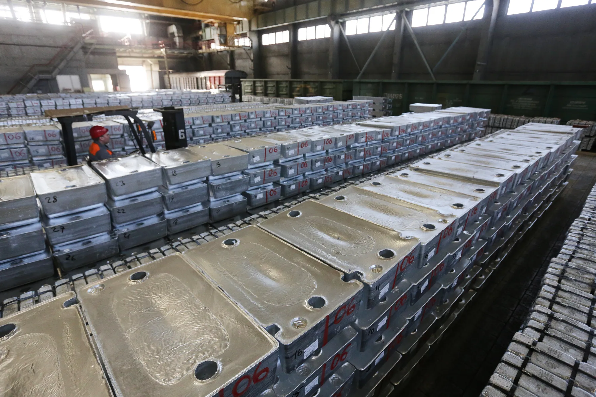 A worker uses a fork-lift truck to move zinc ingots around a storage facility at the Chelyabinsk Zinc Plant (CZP), operated by Ural Mining and Metallurgical Co. (UMMC), in Chelyabinsk, Russia, on Monday, March 6, 2017. Russia’s No. 1 zinc miner and No. 2 copper producer plans a far-reaching expansion of its diversified minerals output, billionaire co-owner and Chief Executive Officer Andrey Kozitsyn said in an interview.