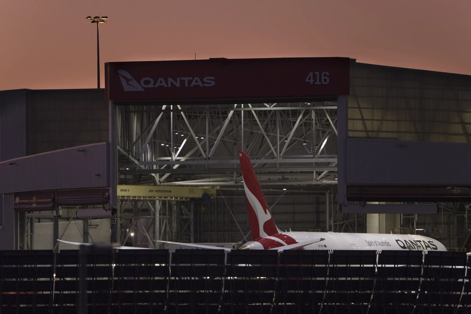 An aircraft operated by Qantas Airways Ltd. outside a maintenance facility at Sydney Airport in Sydney, Australia.