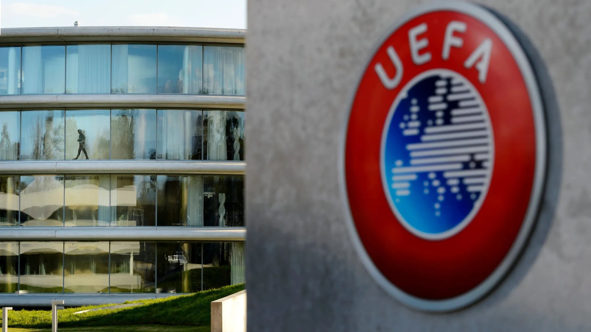 A man walks inside the headquarters of European football body UEFA in Nyon on April 6, 2016.
