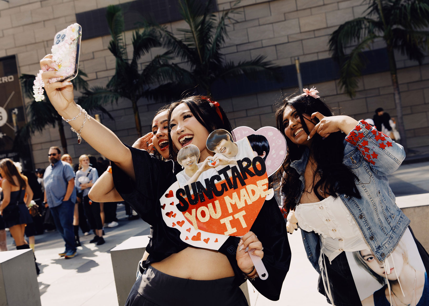 Photo of Riize fans taking selfies outside the Peacock Theater ahead of the Riize fan-concert 'Riizing Day' in Los Angeles, US in May 2024.