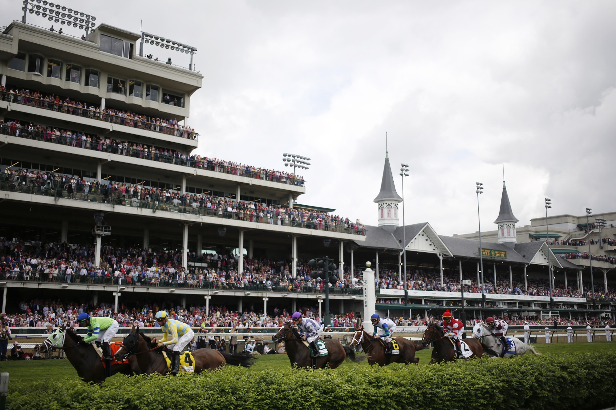 Thoroughbred racehorses compete in a turf race ahead of the 145th running of the Kentucky Derby at Churchill Downs in Louisville, Kentucky in 2019.