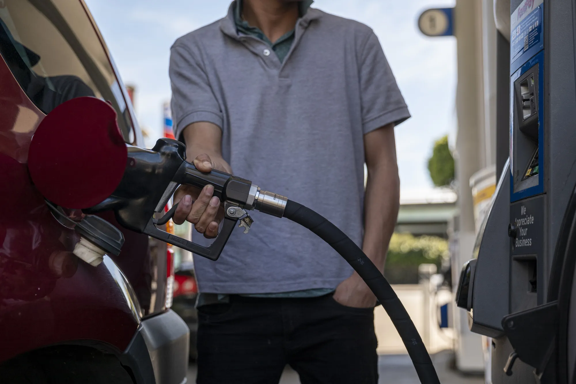 A driver refuels at a gas station in San Francisco, California on&nbsp;March 7.&nbsp;