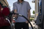 A driver refuels at a gas station in San Francisco, California on March 7. 