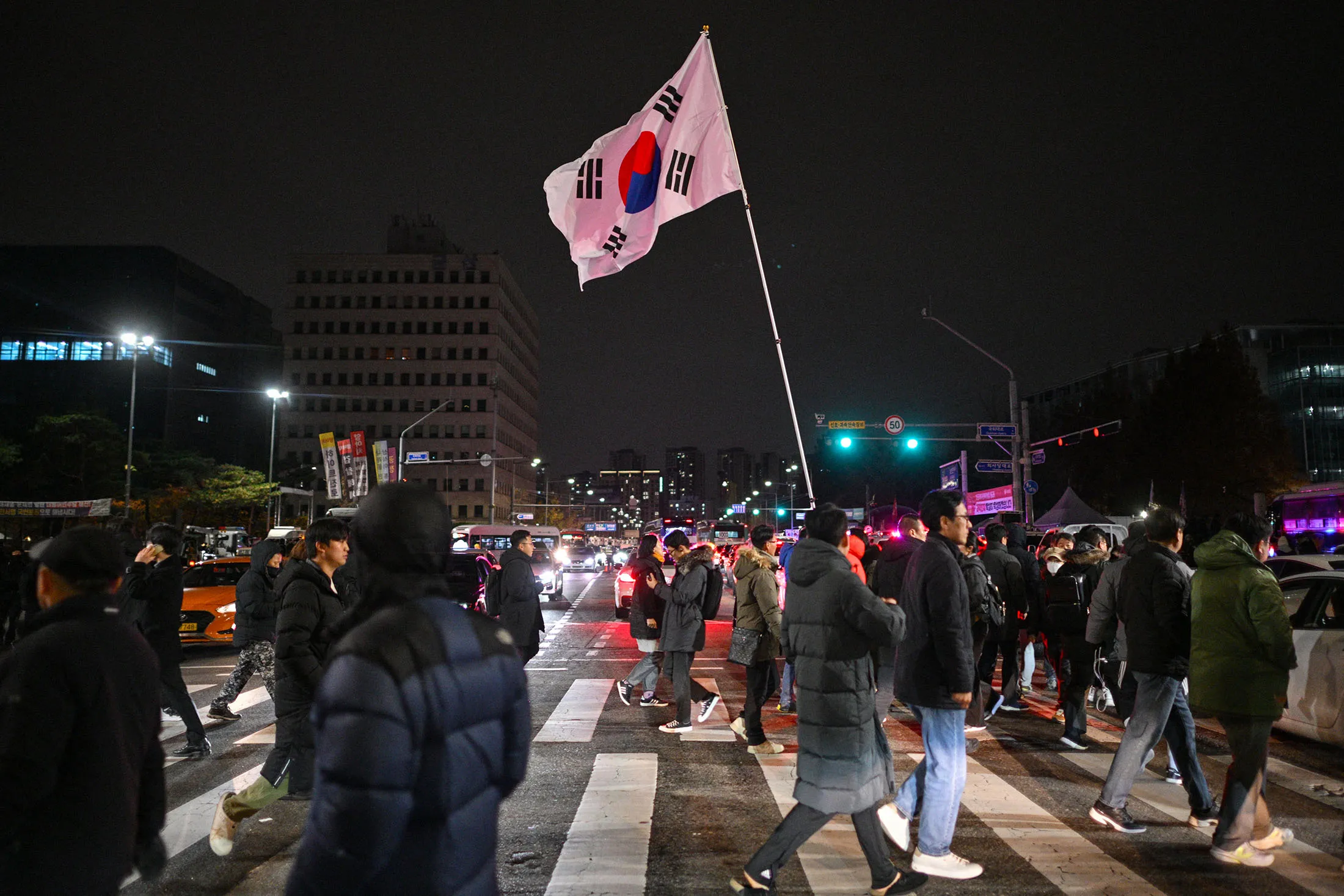 Koreans gather outside the National Assembly in Seoul on Dec. 4. after President Yoon Suk Yeol declared emergency martial law.