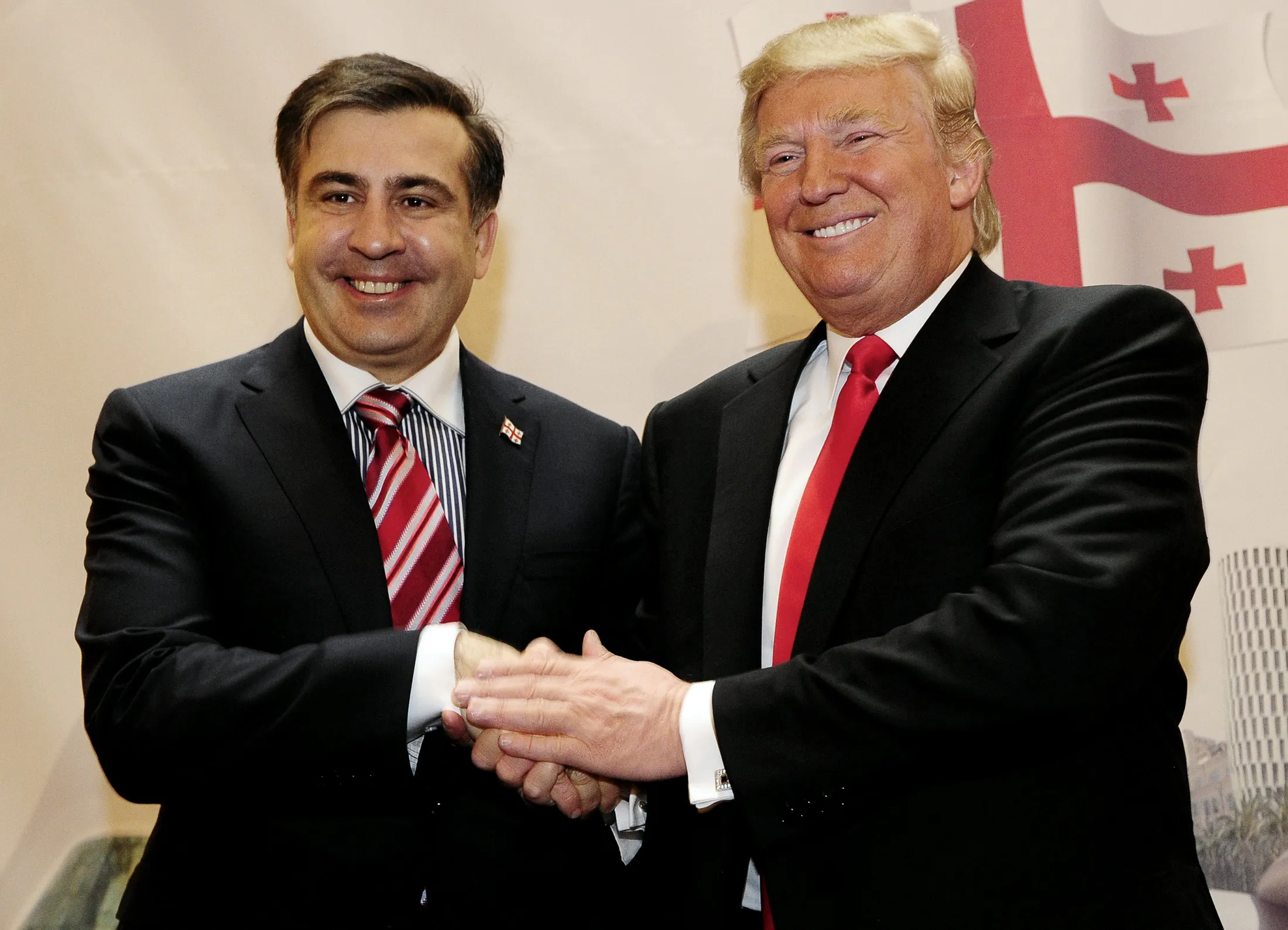 Georgia's President Mikheil Saakashvili, left, and Donald Trump shake hands during a press conference, on March 10, 2011.
